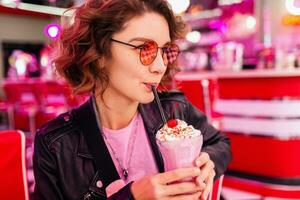 stylish smiling woman in retro vintage cafe photo