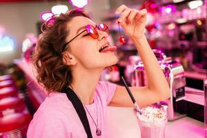 stylish smiling woman in retro vintage cafe photo