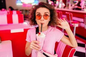 stylish smiling woman in retro vintage cafe photo