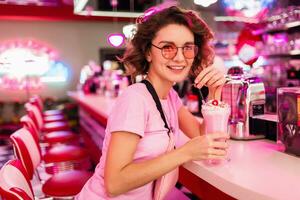 stylish smiling woman in retro vintage cafe photo