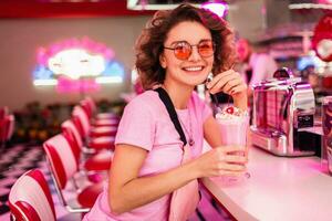 stylish smiling woman in retro vintage cafe photo