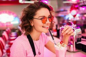 stylish smiling woman in retro vintage cafe photo