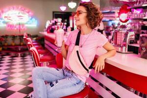 stylish smiling woman in retro vintage cafe photo