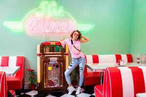 stylish smiling woman in retro vintage cafe photo