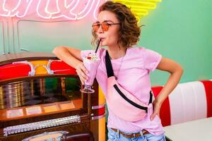 stylish smiling woman in retro vintage cafe photo