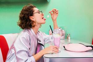 stylish smiling woman in retro vintage cafe photo