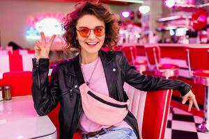 stylish smiling woman in retro vintage cafe photo