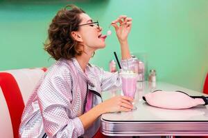 stylish smiling woman in retro vintage cafe photo