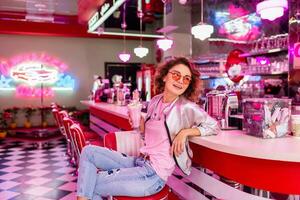 stylish smiling woman in retro vintage cafe photo