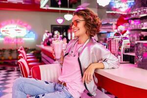 stylish smiling woman in retro vintage cafe photo