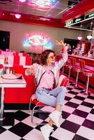 stylish smiling woman in retro vintage cafe photo