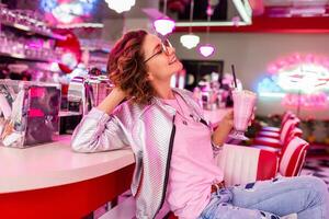 stylish smiling woman in retro vintage cafe photo