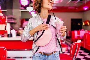 stylish smiling woman in retro vintage cafe photo