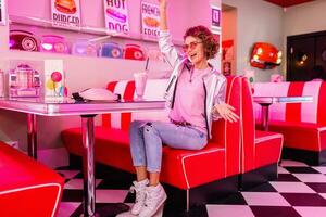 stylish smiling woman in retro vintage cafe photo