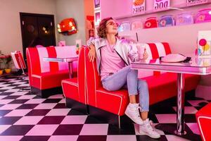 stylish smiling woman in retro vintage cafe photo