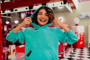 stylish smiling woman in retro vintage cafe photo