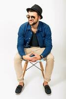 young handsome hipster man stylish outfit, denim shirt photo