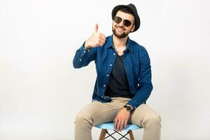 young handsome hipster man in stylish outfit photo