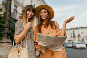 stylish young women traveling together summer fashion style dresses photo