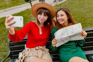 stylish young women traveling together summer fashion style photo