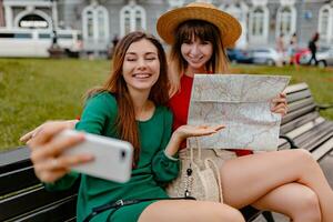 stylish young women traveling together summer fashion style photo