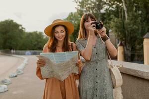 stylish young women traveling together summer fashion style dresses photo