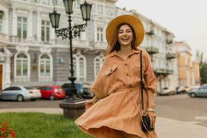 stylish young woman dressed in spring trendy dress photo