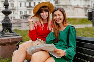 stylish young women traveling together summer fashion style photo