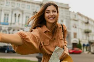 stylish young woman dressed in spring trendy dress photo