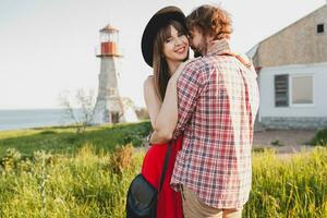 young stylish couple in love in countryside, indie hipster bohemian style photo