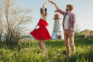 young stylish couple in love in countryside, indie hipster bohemian style photo