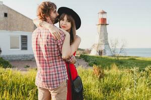 young stylish couple in love in countryside, indie hipster bohemian style photo