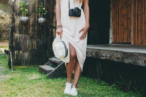 young natural beautiful woman in pale gown, tropical vacation photo