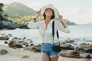 young beautiful hipster woman on summer vacation photo