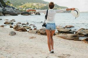 young beautiful hipster woman on summer vacation photo