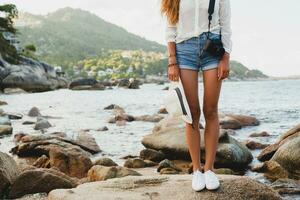 young beautiful hipster woman on summer vacation photo