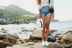 young beautiful hipster woman on summer vacation photo