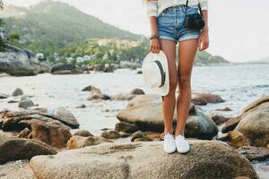 young beautiful hipster woman on summer vacation photo