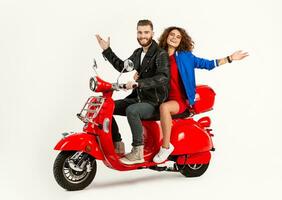 young attractive couple riding an electric motorbike scooter happy having fun together photo