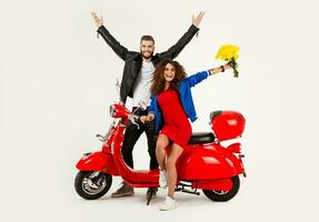 young attractive couple riding an electric motorbike scooter happy having fun together photo