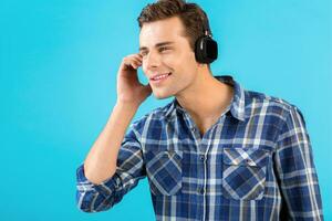stylish young man listening to music on wireless headphones photo