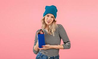 young woman holding music speaker photo