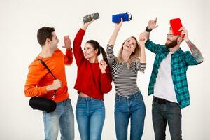 company of friends having fun together listening to music photo