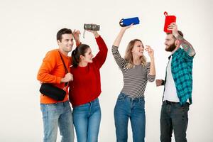 company of friends having fun together listening to music photo