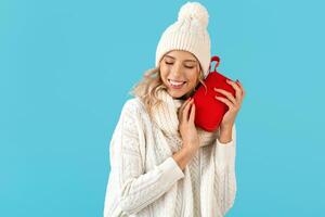 stylish young woman holding wireless speaker photo