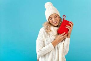 stylish young woman holding wireless speaker photo