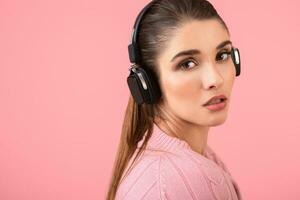 young woman listening to music in headphones photo