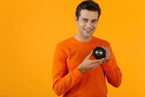 stylish young man holding wireless speaker photo