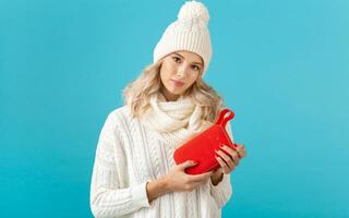 stylish young woman holding wireless speaker photo