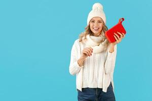 stylish young woman holding wireless speaker photo